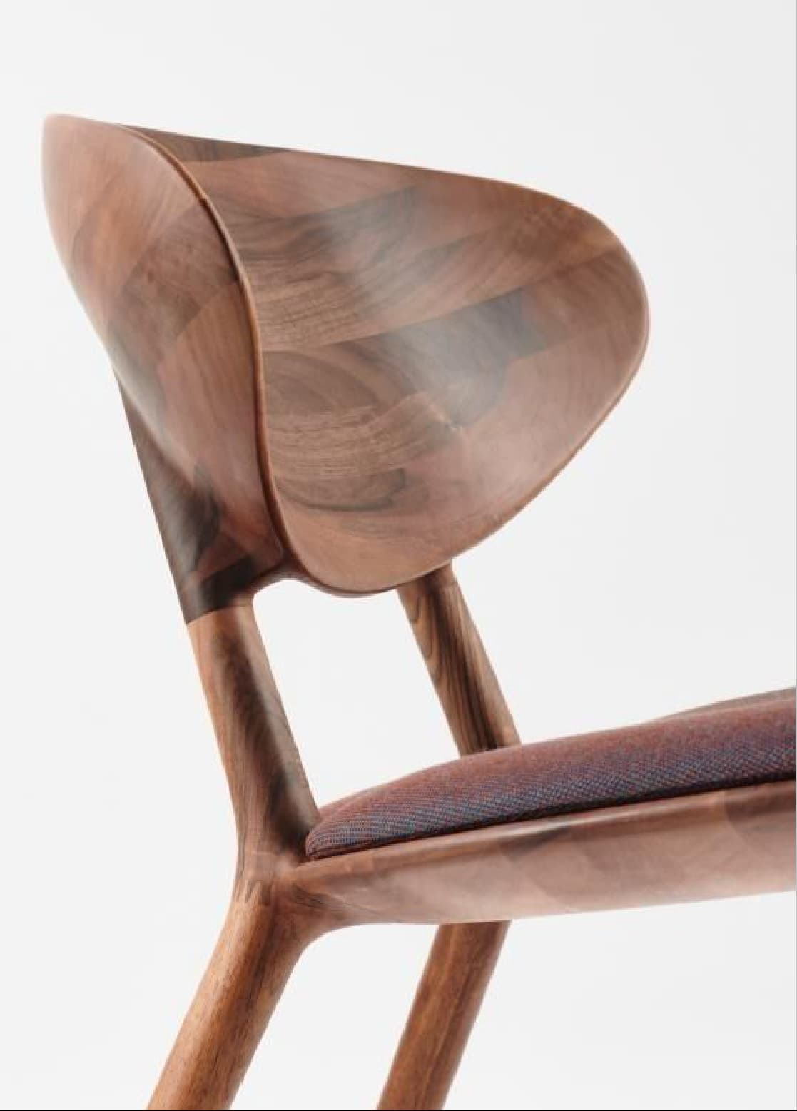 Sculpted walnut chair backrest, detail of curved joinery