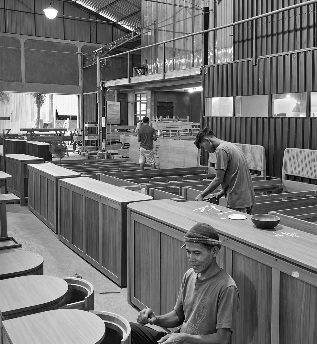 Artisans working inside a furniture workshop in Jepara
